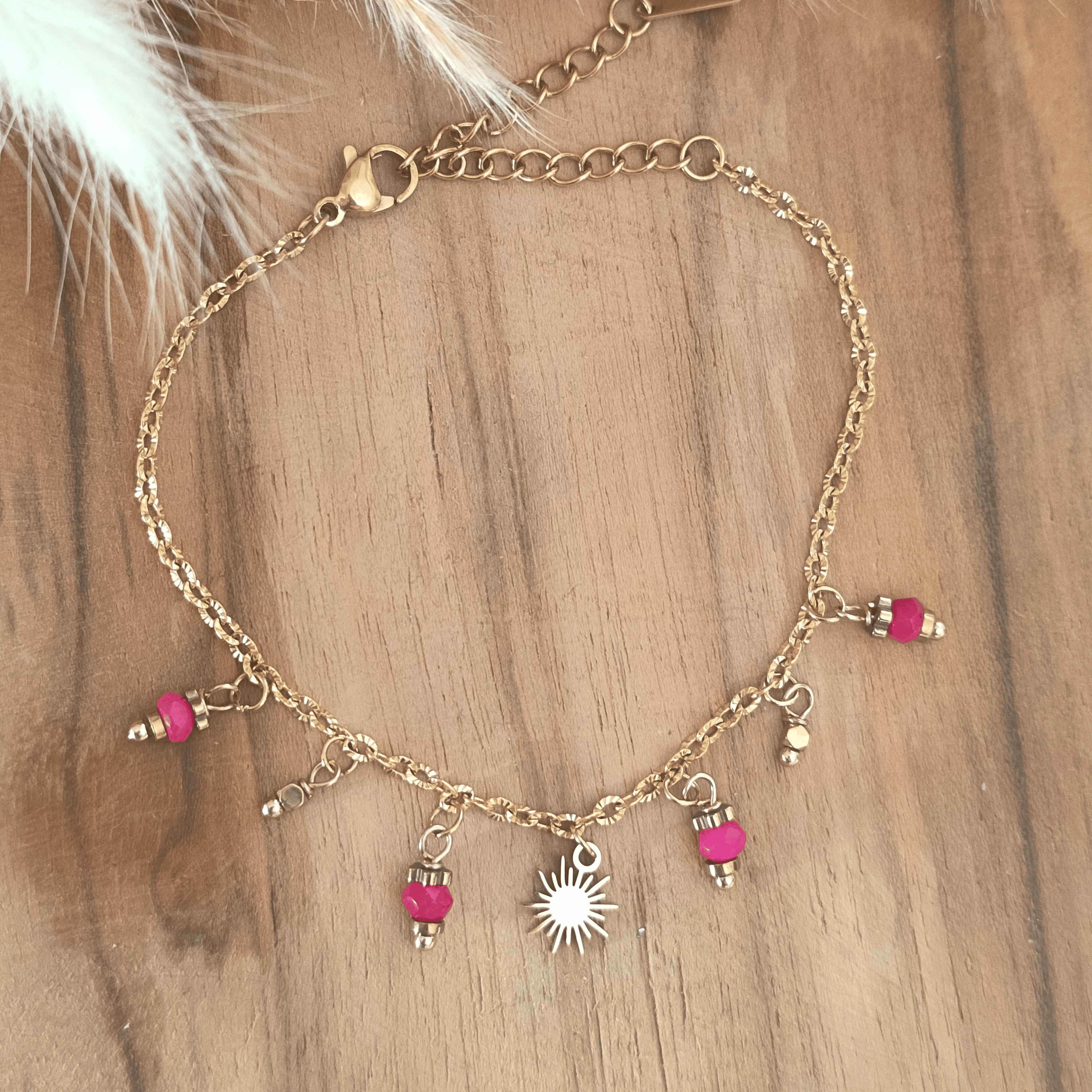 Bracelet breloques soleil & perles roses